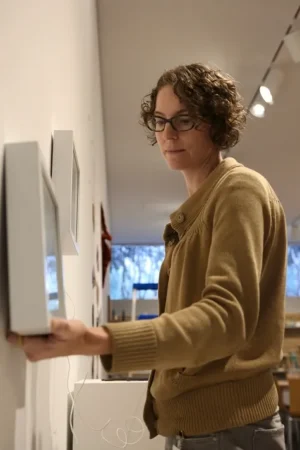artist xtine burrough installing her work at the DMA